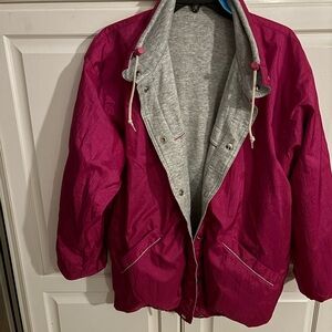 Reversible pink windbreaker and grey‎ sweatshirt jacket. Size medium.